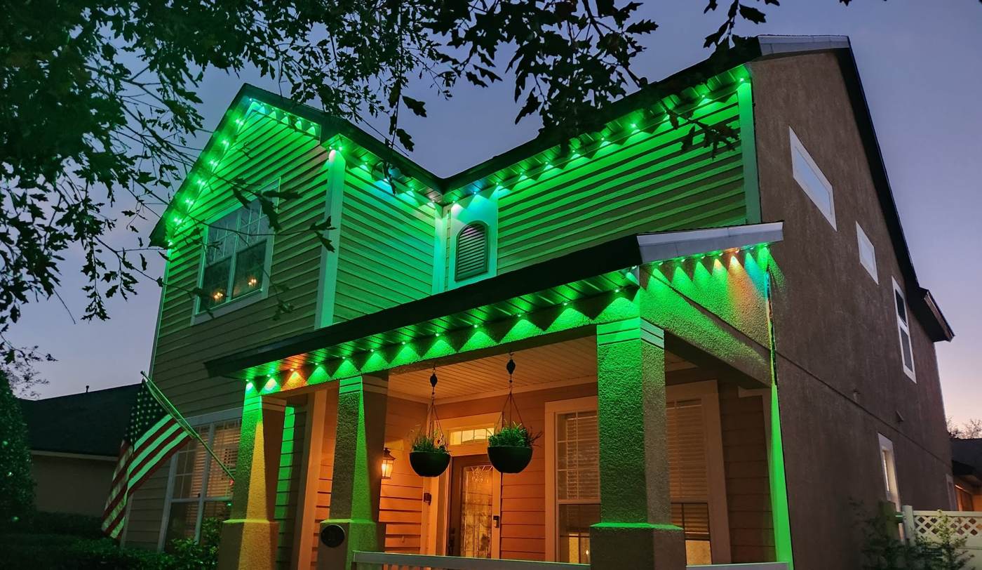 Same home glowing all green at dusk